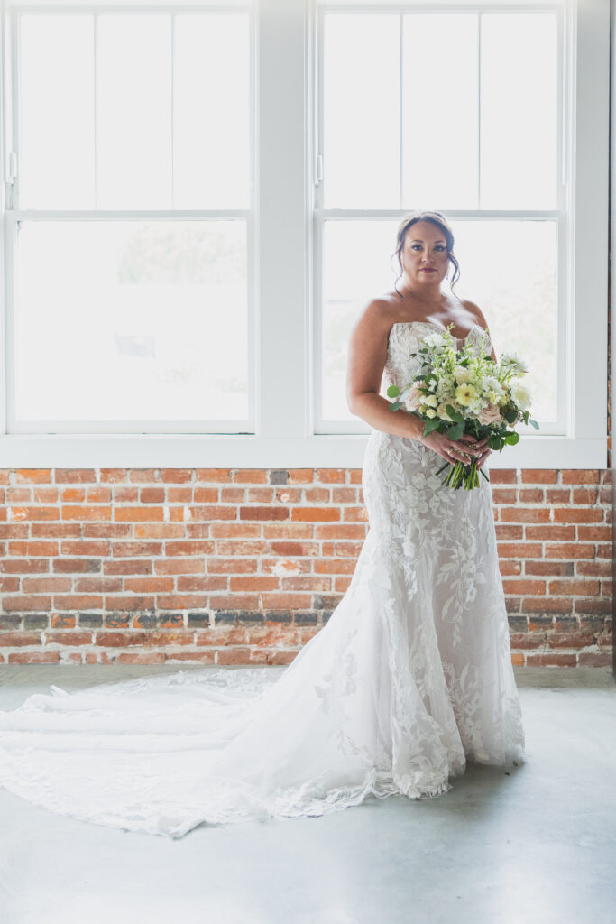 Bride in her wedding gown getting ready in the penthouse suite at Hotel Cerro in San Luis Obispo