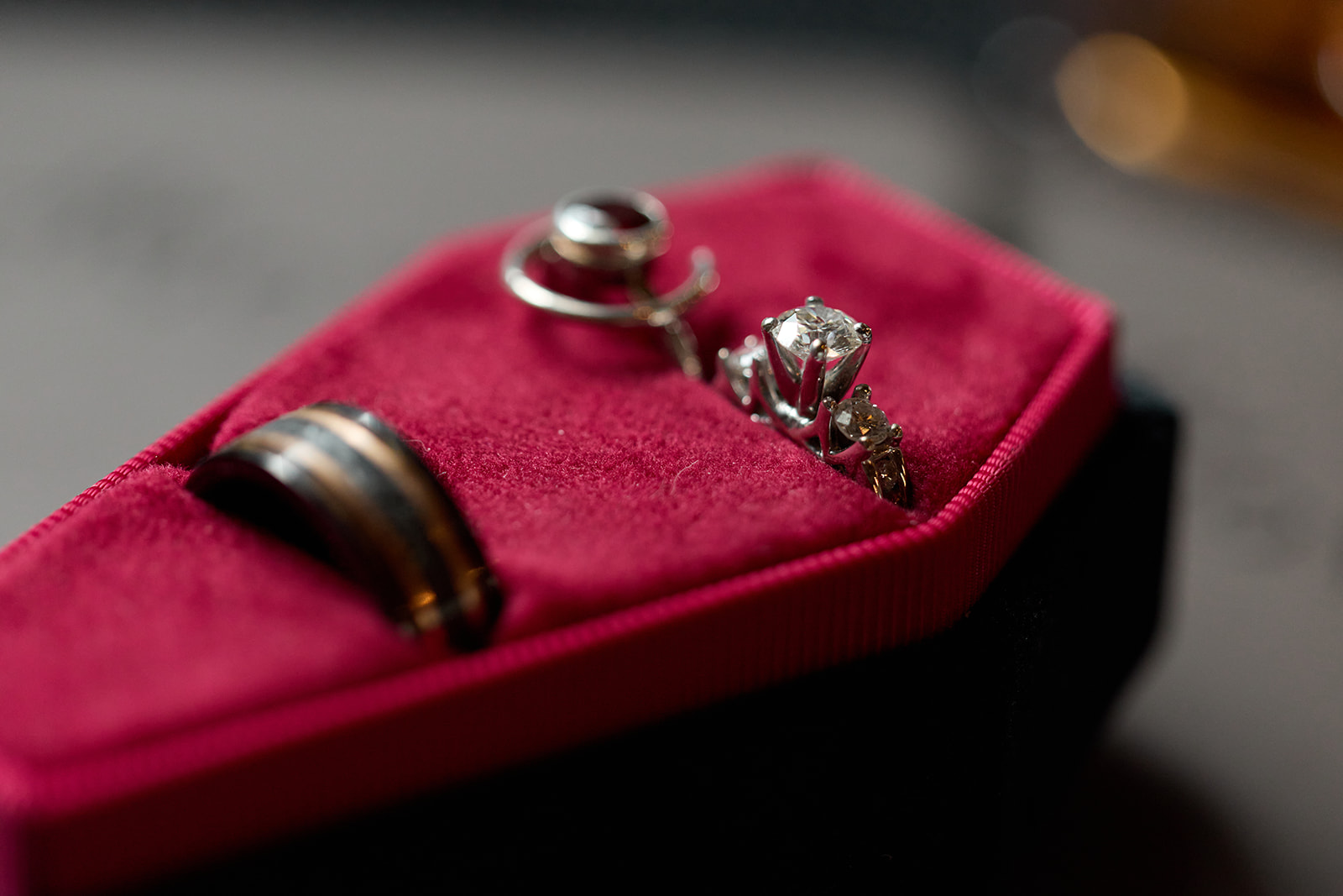 Wedding rings in a red velvet coffin ring box